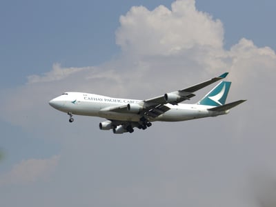 cathay airways plane on runway