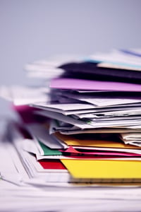 stack of folders and paperwork