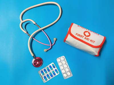 first aid kit on blue background