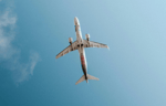 Underbelly of a plane from the ground view.