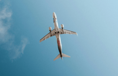 Underbelly of a plane from the ground view.