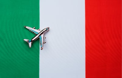 Italian flag with airplane figurine.