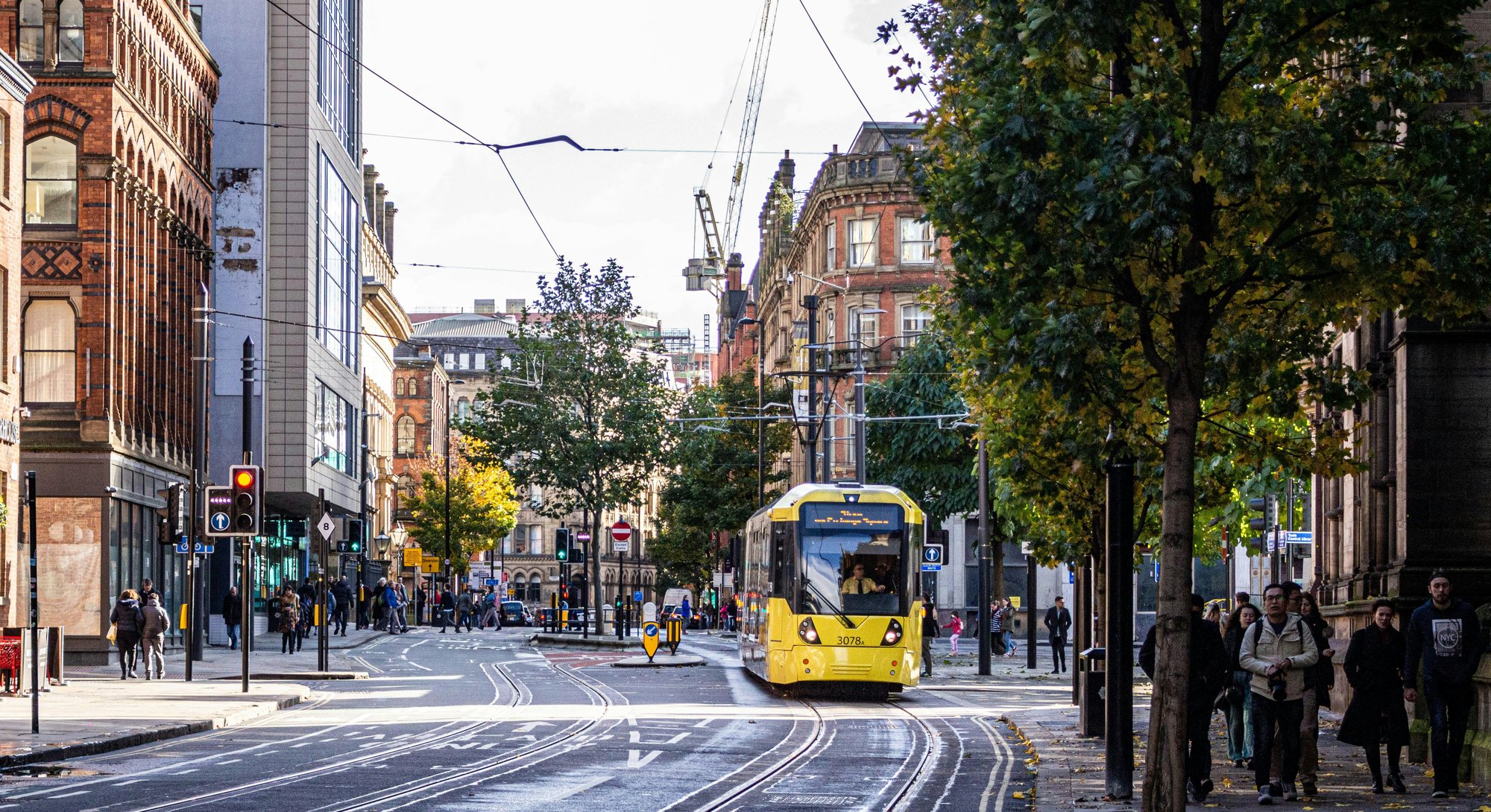 Manchester street with yellow bus Manchester street with yellow bus