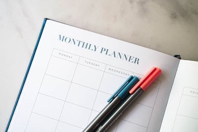 monthly planner with pens