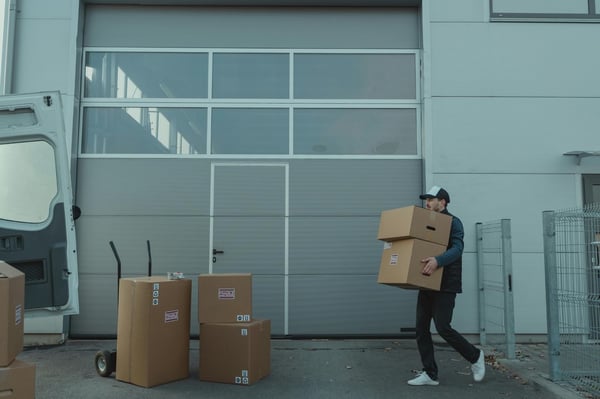 Guy holding moving boxes