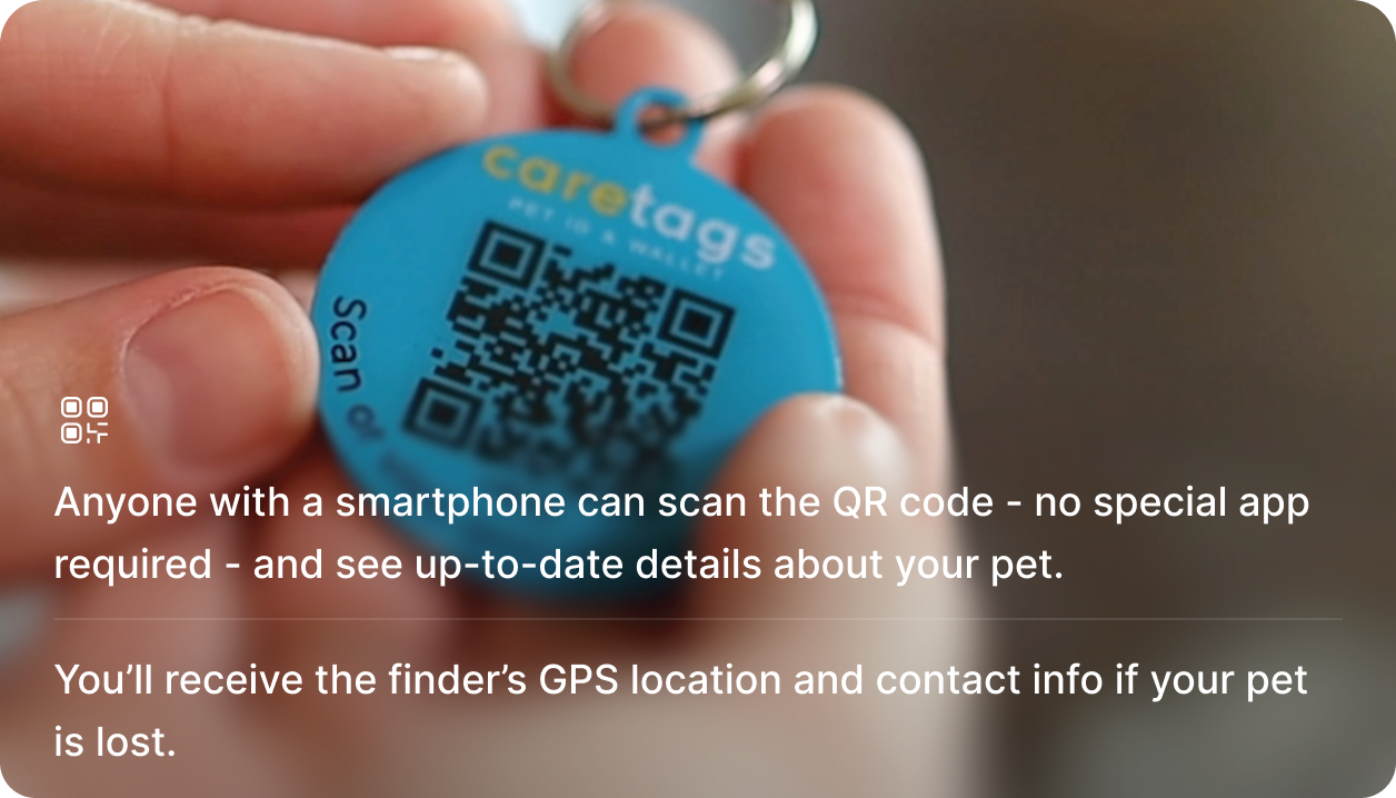 Person holding a CareTag pet ID tracking tag.