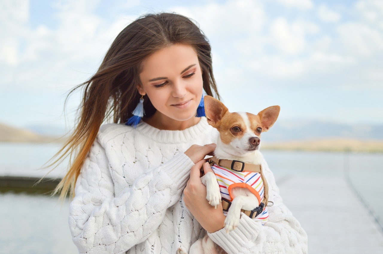 girl holding dog